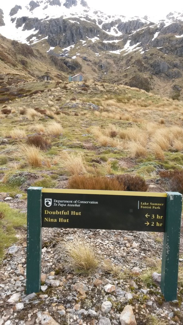 I was thinking about cooking an early dinner and settling down with the latest edition of National Geographic on my phone when I noticed the pair of boots outside the door.  Two pairs, to be precise.  It's a two-bunk hut.  Darn.  