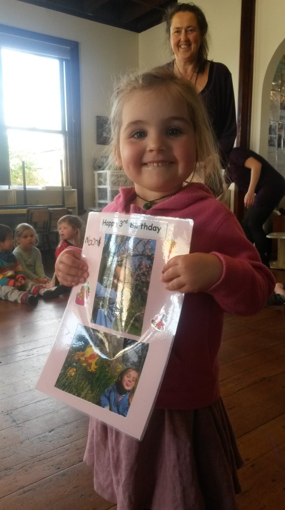 At school music time she got to be the birthday centerpiece, proudly showing every child sitting in the circle her card. 