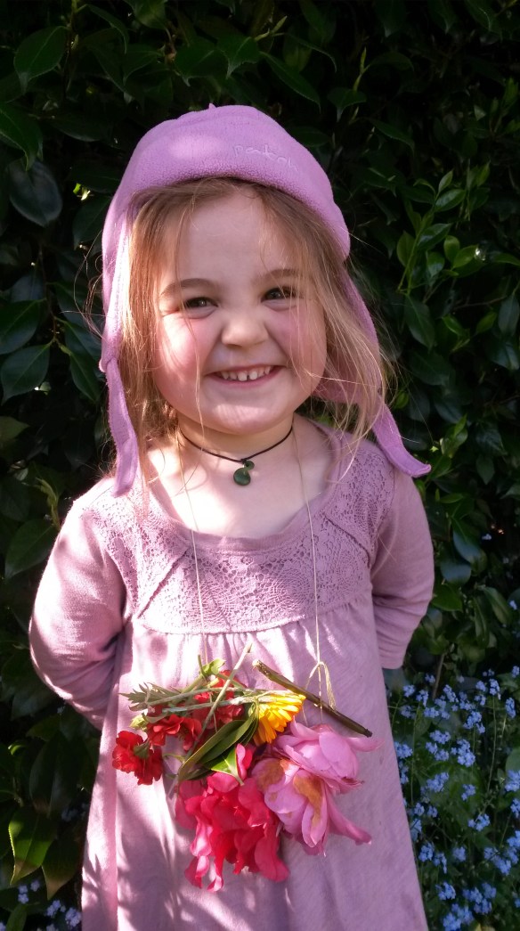 He then went on to sew a flower necklace for Naomi, who had decided that matching her hat color to her dress was more important than keeping the sun off her face.