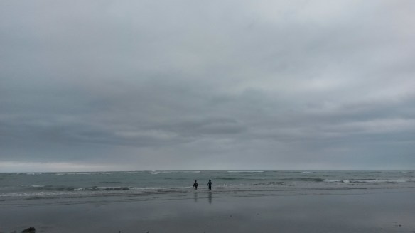 The beach was pretty quiet when we arrived, as it was overcast and a bit chill, but the novelty of going to the beach on Christmas day is still worth it for us.  Sand + Water = Kid Happiness.  Us parents sipped our coffees with Baileys and avoided the incoming tide.  